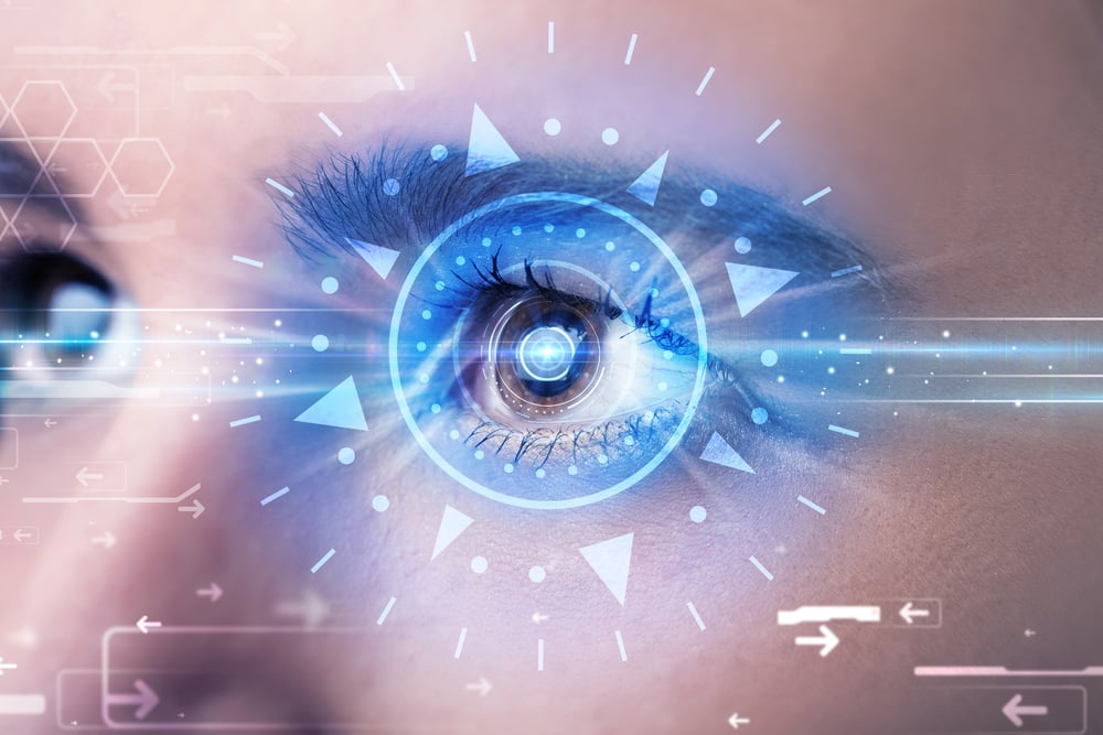 Modern cyber girl with technolgy eye looking into blue iris